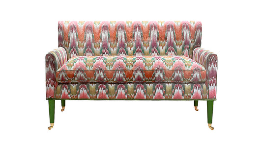 David Seyfried Salvesen Graham sofa in Fabricut Resurgence Berry fabric, Edge contrast piping in leaf, Caterpillar trim in Foilage around base and Little Greene Hopper painted legs.