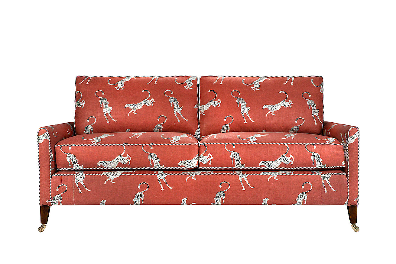 David Seyfried Sanford sofa in  Altfield Bagheera Chili fabric with Romo Stripe piping